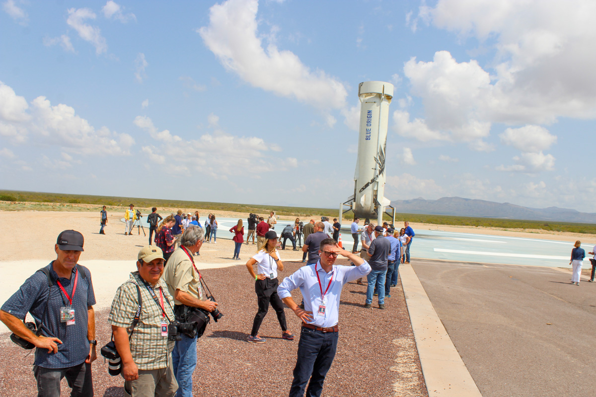 The New Shepard booster on the landing pad. Blue Origin invited dozens of reporters to witness the launch. (VHA-Photo/LM)