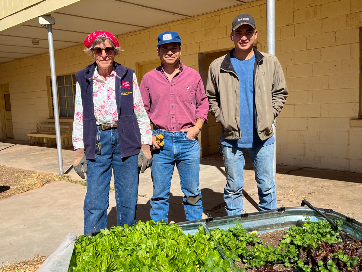 Texas Master Gardener Joy Scott, Texas AgriLife Extension agent Zach Schaefer, and Culberson county employee Devon Ortega show off some of the leafy greens growing. The team also planted six different varieties of Earth-Kind roses as part of the garden project. (VHA-Photo/SC)